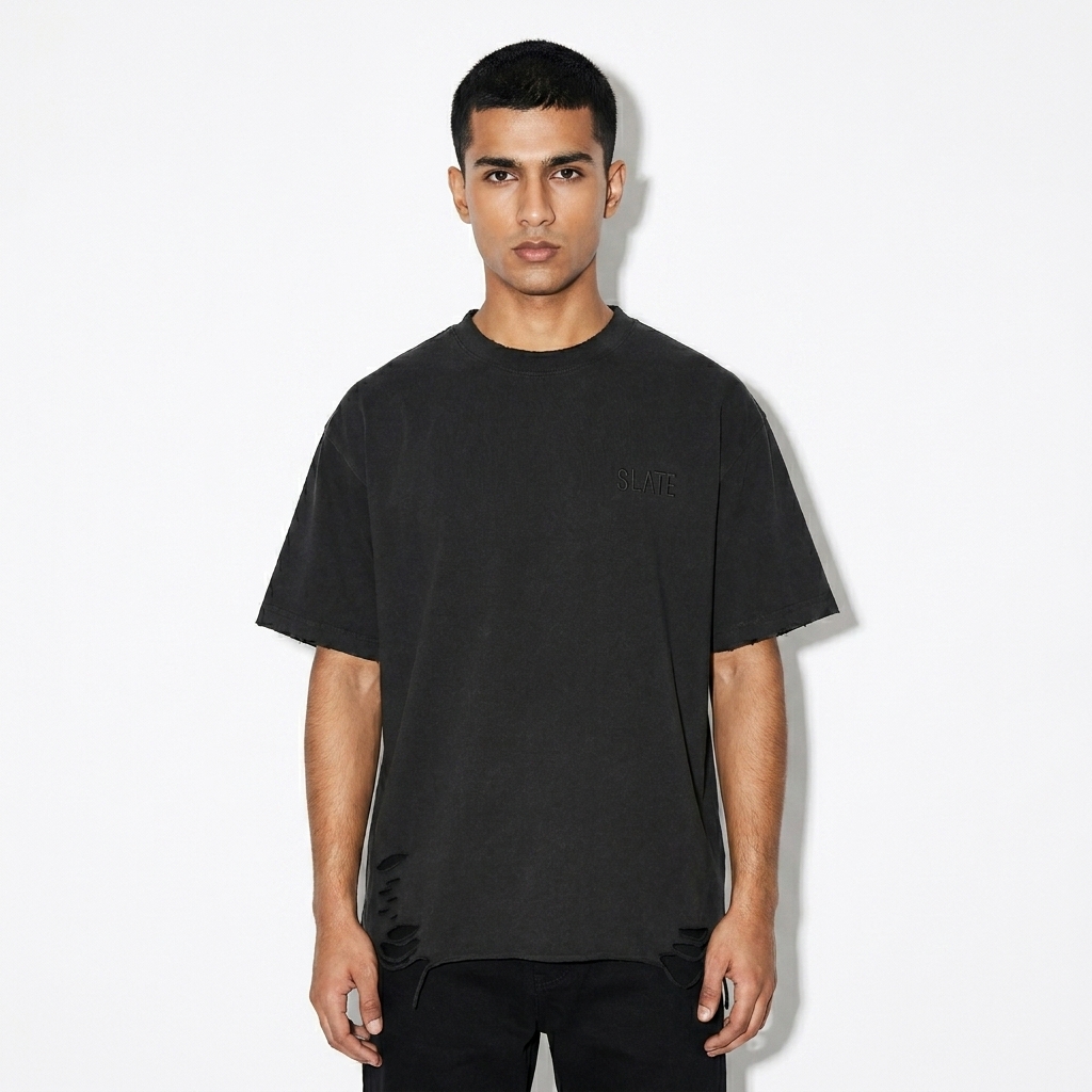 Snow Washed Raw-Hem T-Shirt worn by a petite Pakistani male fashion influencer, gorpcore outdoor styling, studio lookbook — custom snow washed raw-hem t-shirt