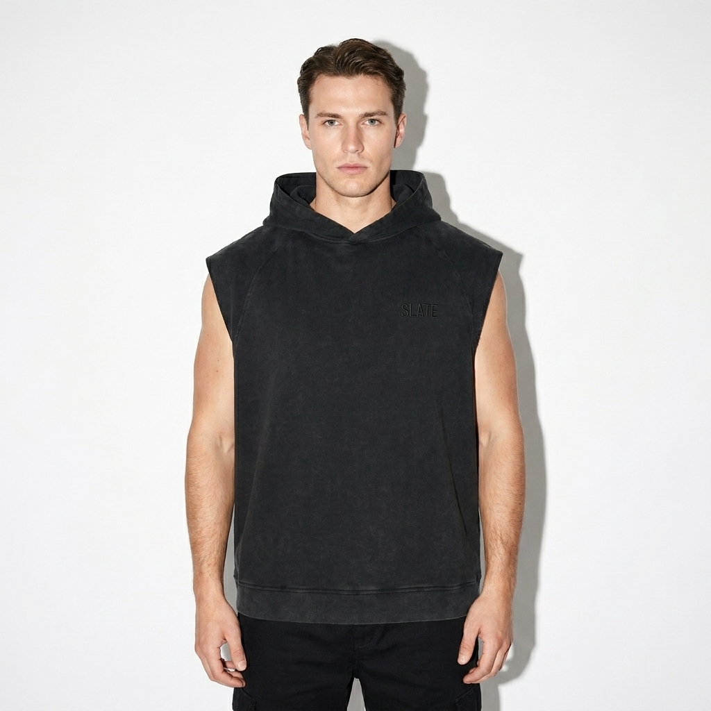 Snow Washed Sleeveless Hoodie worn by a mid-size White European male fashion influencer, minimalist luxury styling, studio lookbook — custom snow washed sleeveless hoodie