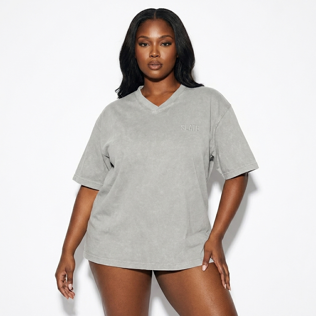 Snow Washed V-Neck T-Shirt worn by a curvy African American female fashion influencer, techwear modern styling, studio lookbook — custom snow washed v-neck t-shirt