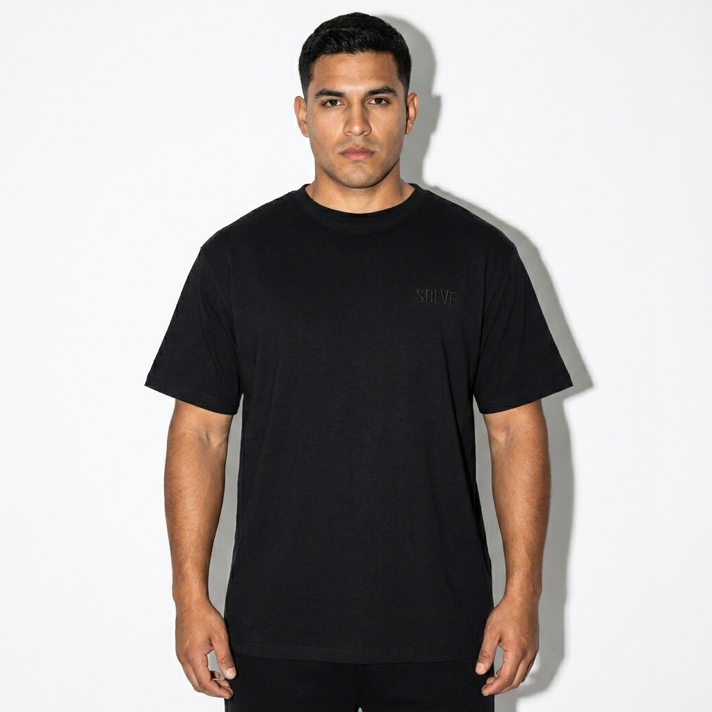 Oversized Cotton T-Shirt worn by a broad-shouldered Hispanic male fashion influencer, techwear modern styling, studio lookbook — custom oversized cotton t-shirt