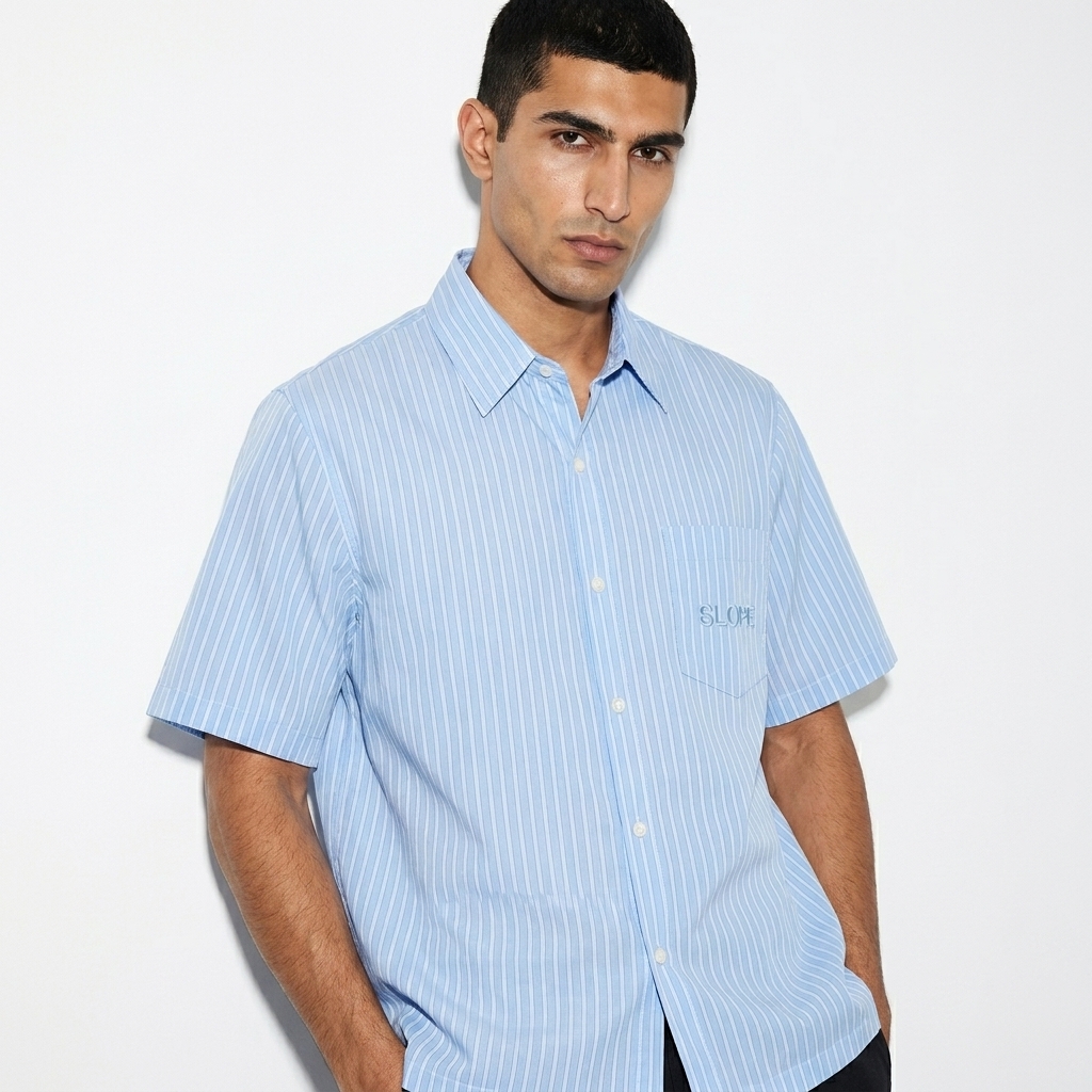 Striped Boxy Short Sleeve Shirt worn by a lean Persian male fashion influencer, y2k revival styling, studio lookbook — custom striped boxy short sleeve shirt