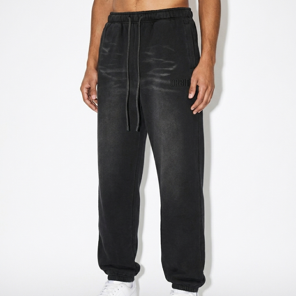 Sunfade Fleeced Sweatpants worn by a slim tall Hispanic male fashion influencer, preppy ivy styling, studio lookbook — custom sunfade fleeced sweatpants