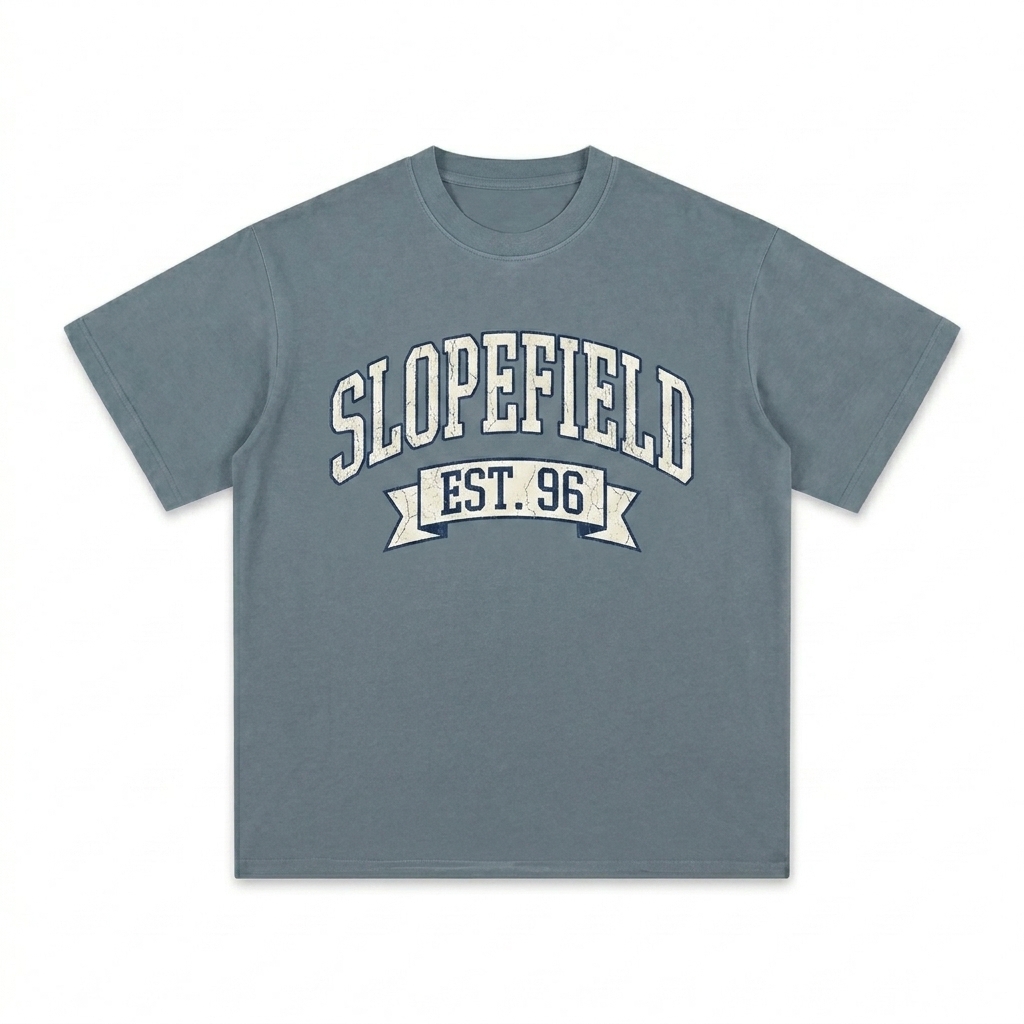 Custom Sunfade Gradient T-Shirt design direction 3: Retro Collegiate Emblem featuring the SLOPEFIELD wordmark