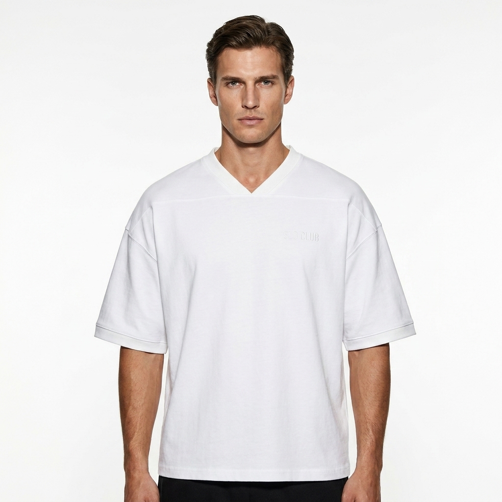 Unisex Color Block Boxy T-Shirt worn by a toned White European male fashion influencer, clean-girl minimal styling, studio lookbook — custom unisex color block boxy t-shirt