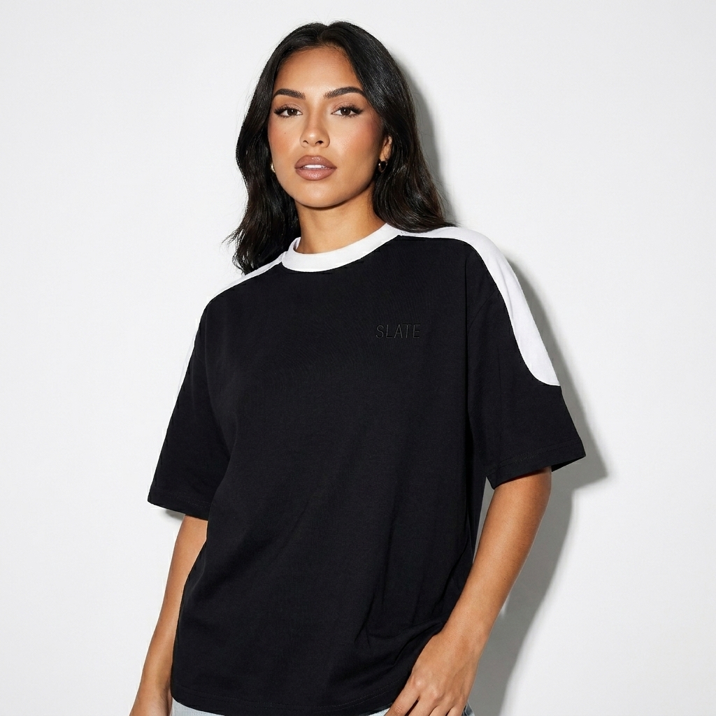 Unisex Color Block Oversized T-Shirt worn by a petite Latino female fashion influencer, downtown streetwear styling, studio lookbook — custom unisex color block oversized t-shirt