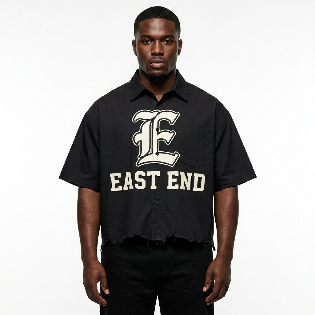 Unisex Distressed Plaid Boxy Shirt worn by a mid-size Black male fashion influencer, workwear utility styling, studio lookbook — custom unisex distressed plaid boxy shirt