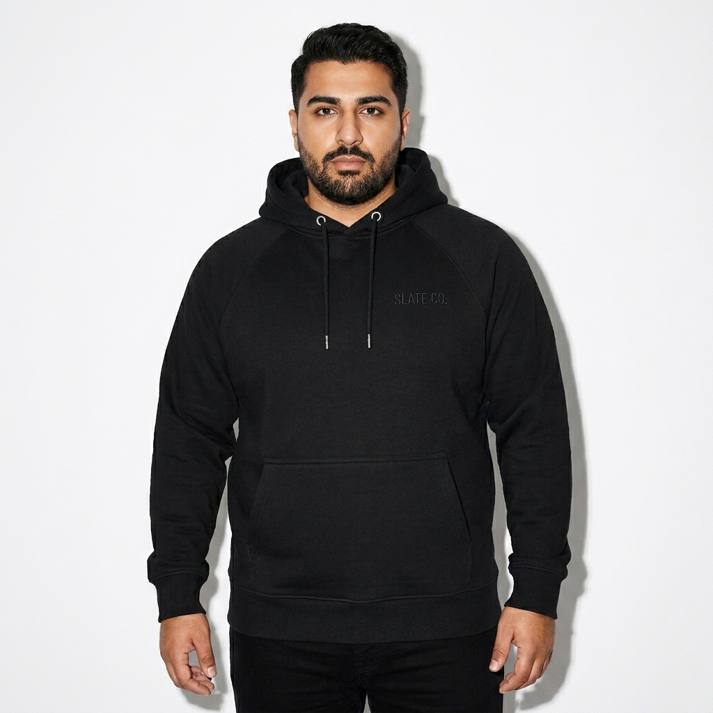 Unisex Eco Raglan Hoodie worn by a curvy Persian male fashion influencer, y2k revival styling, studio lookbook — custom unisex eco raglan hoodie
