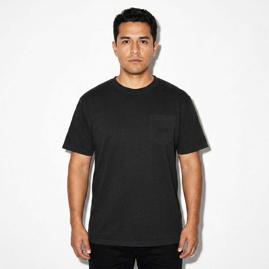 Unisex Garment-Dyed Pocket T-Shirt worn by a mid-size Hispanic male fashion influencer, editorial avant-garde styling, studio lookbook — custom unisex garment-dyed pocket t-shirt