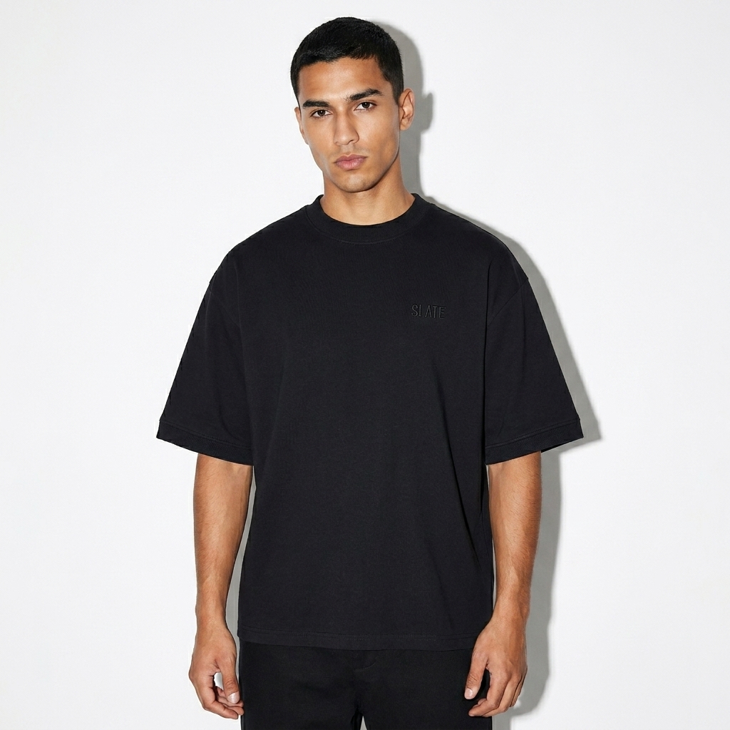 Unisex Heavyweight Boxy T-Shirt worn by a lean Hispanic male fashion influencer, y2k revival styling, studio lookbook — custom unisex heavyweight boxy t-shirt
