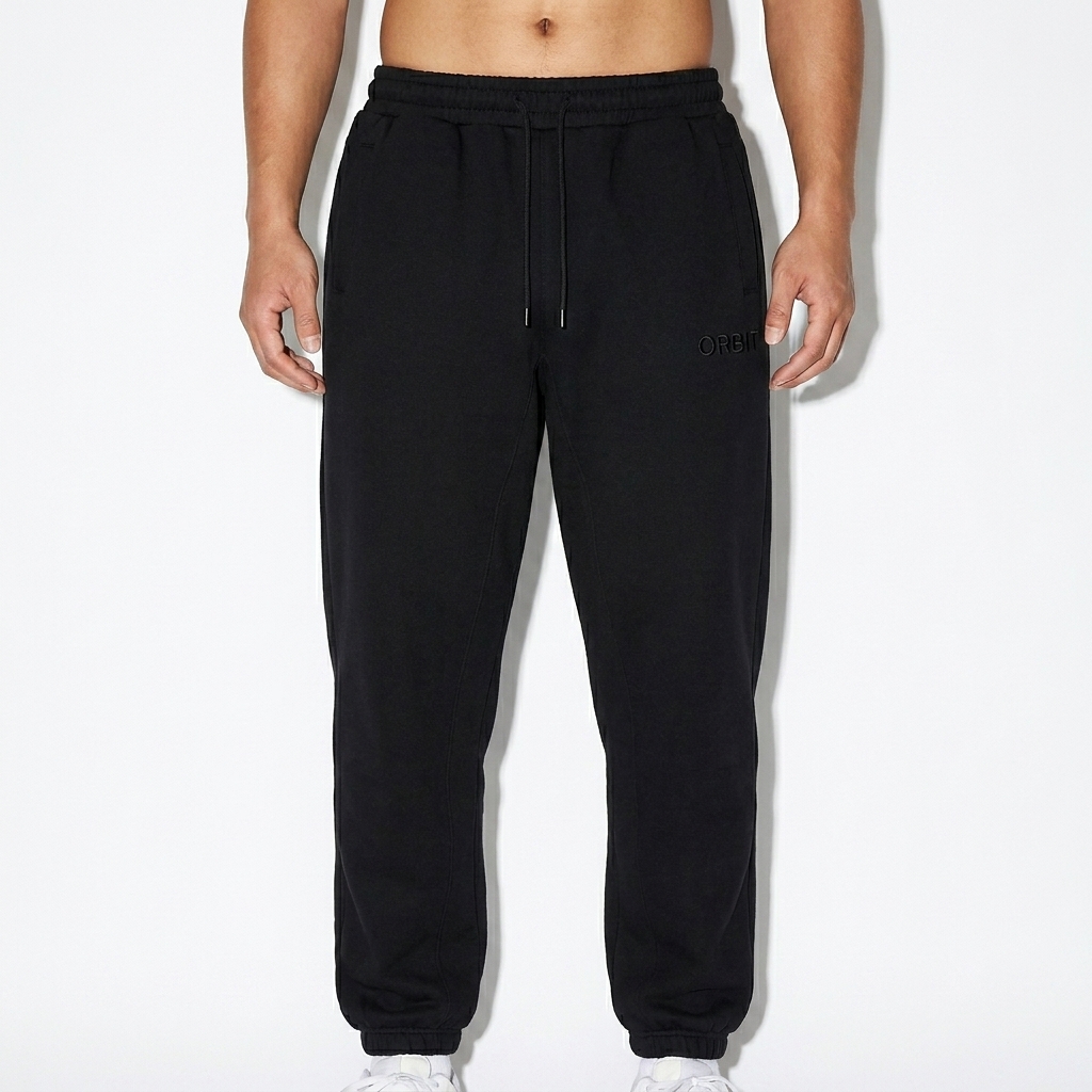 Unisex Heavyweight Fleece Joggers worn by a broad-shouldered Chinese male fashion influencer, downtown streetwear styling, studio lookbook — custom unisex heavyweight fleece joggers