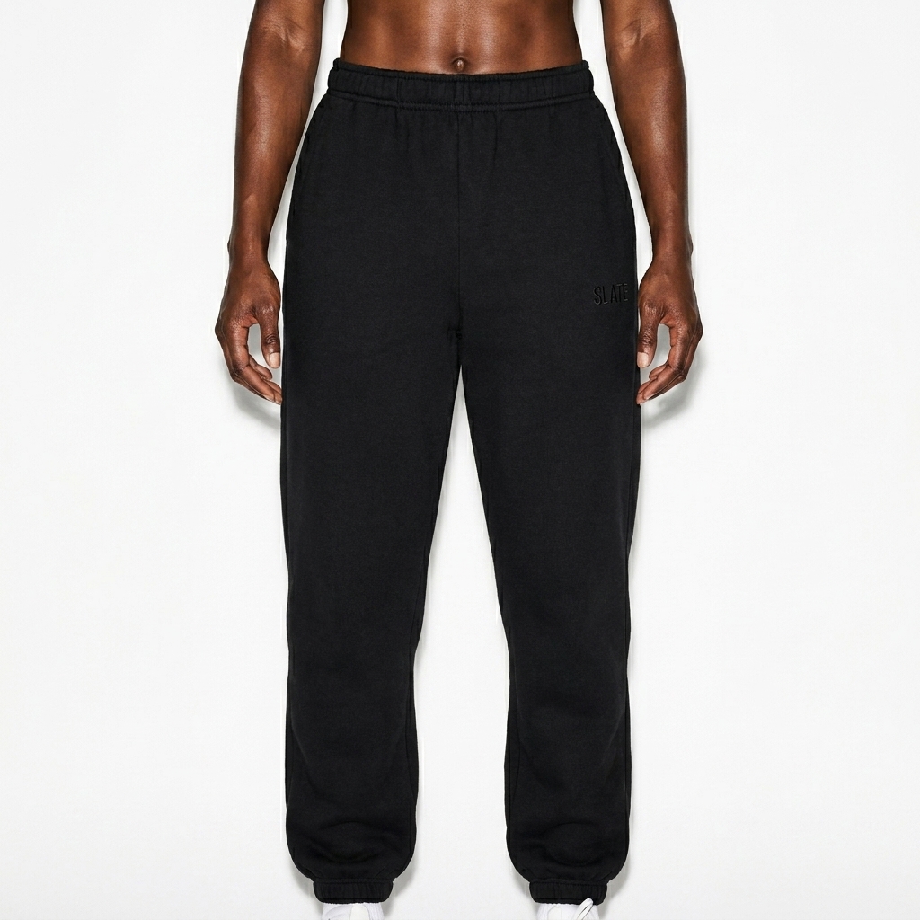 Unisex Heavyweight Sweatpants worn by a athletic muscular Black female fashion influencer, clean-girl minimal styling, studio lookbook — custom unisex heavyweight sweatpants