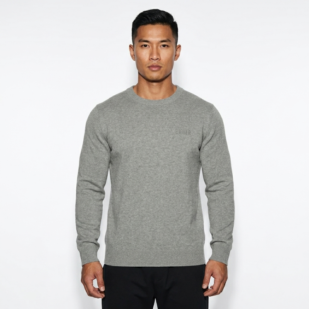 Unisex Knit Crewneck Sweater worn by a athletic muscular Vietnamese male fashion influencer, sporty athleisure styling, studio lookbook — custom unisex knit crewneck sweater