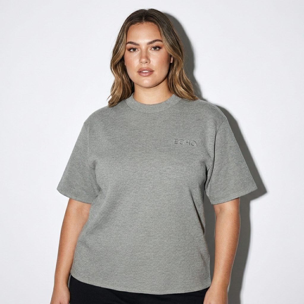 Unisex Knitted T-Shirt worn by a curvy Australian female fashion influencer, editorial avant-garde styling, studio lookbook — custom unisex knitted t-shirt