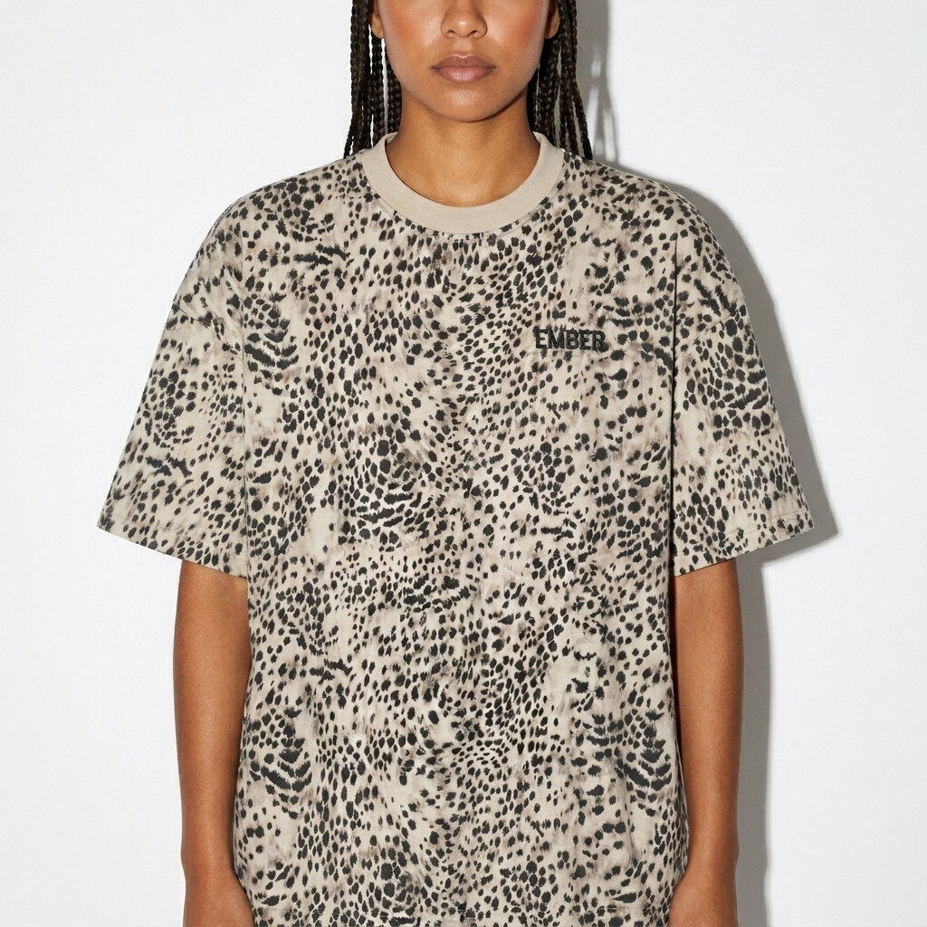 Unisex Leopard Print Boxy T-Shirt worn by a petite Indigenous American female fashion influencer, editorial avant-garde styling, studio lookbook — custom unisex leopard print boxy t-shirt