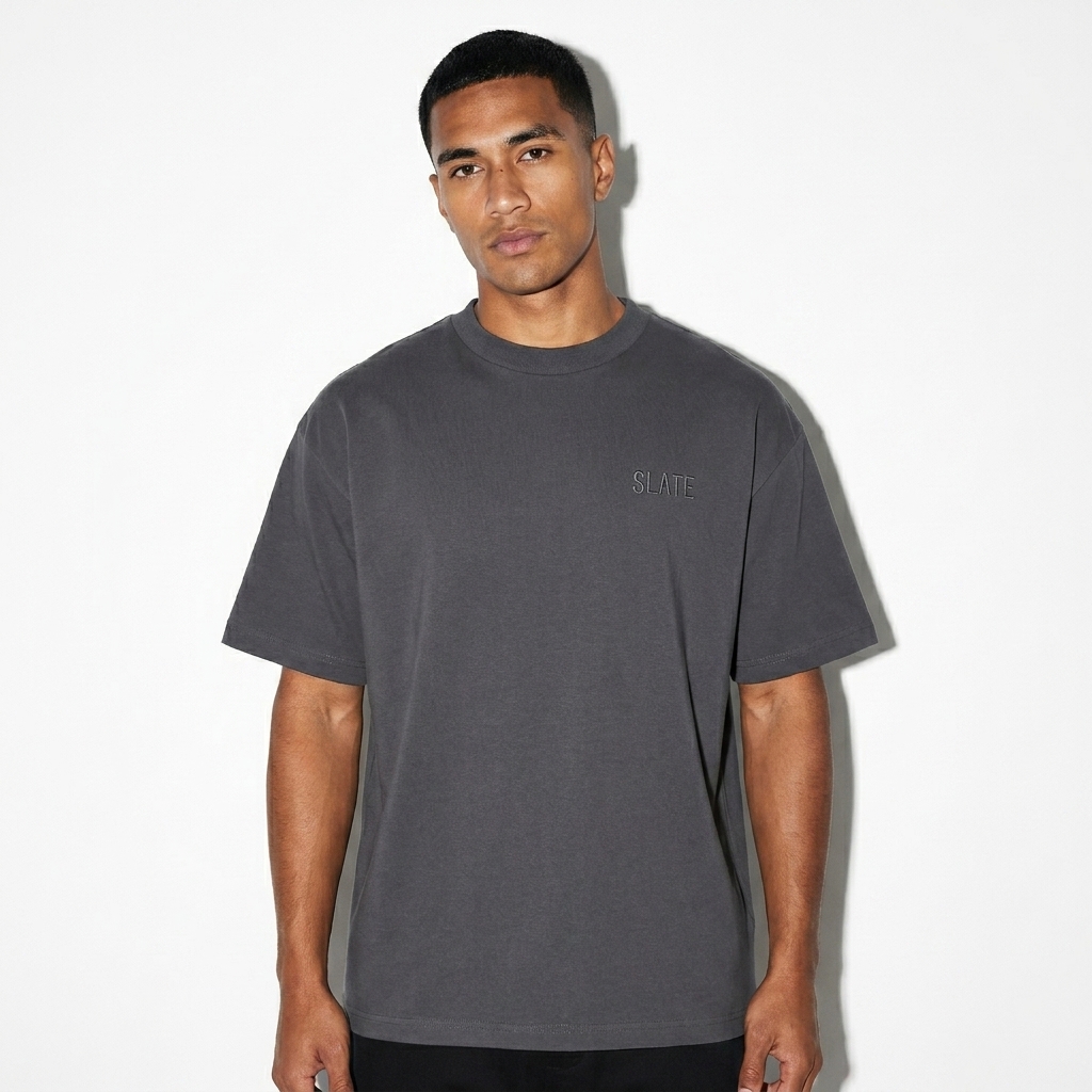 Unisex Lightweight Oversized T-Shirt worn by a lean Pacific Islander male fashion influencer, workwear utility styling, studio lookbook — custom unisex lightweight oversized t-shirt