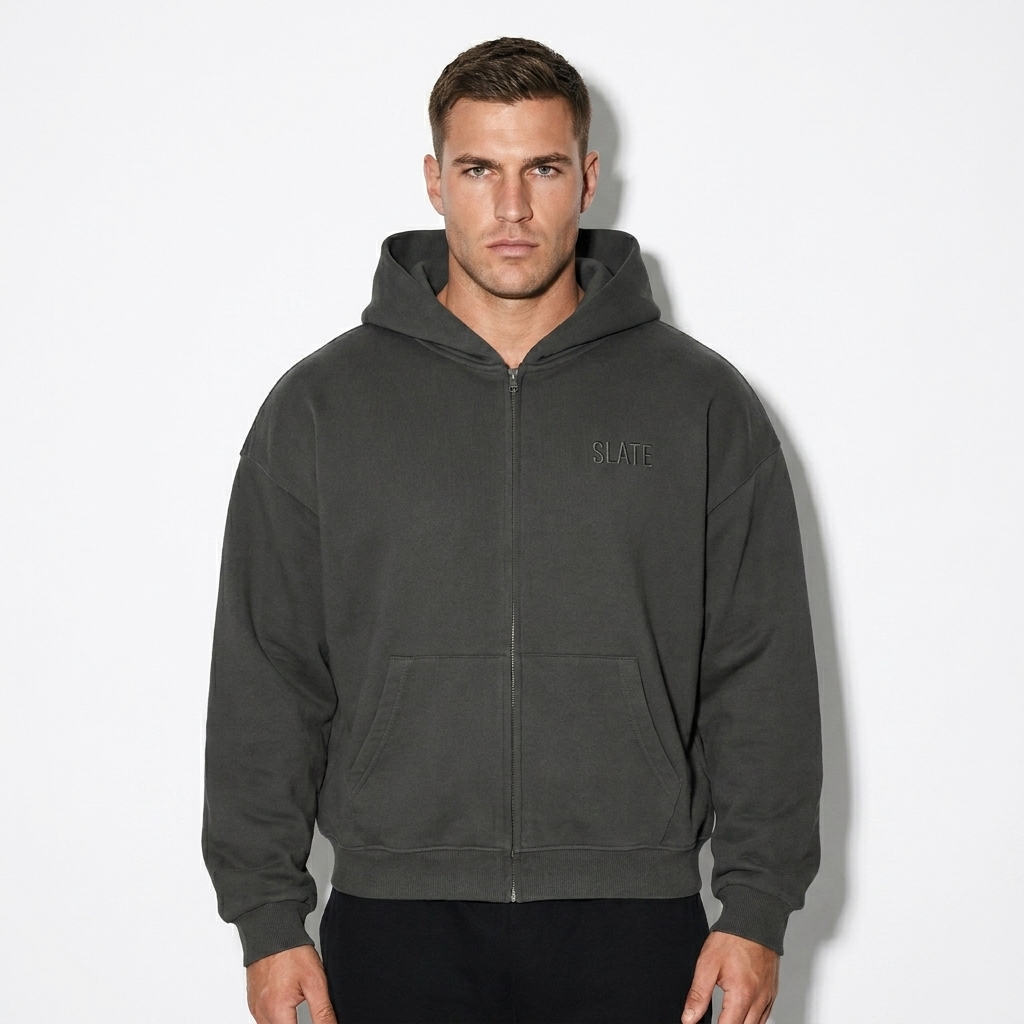Unisex Loose Fit Full-Zip Hoodie worn by a broad-shouldered German male fashion influencer, techwear modern styling, studio lookbook — custom unisex loose fit full-zip hoodie