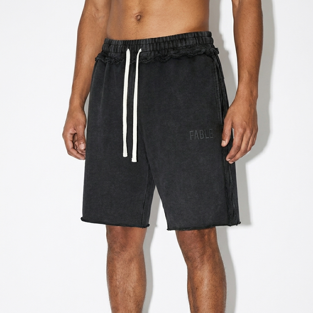 Unisex Mineral Wash Raw Edge Shorts worn by a slim tall Latino male fashion influencer, sporty athleisure styling, studio lookbook — custom unisex mineral wash raw edge shorts