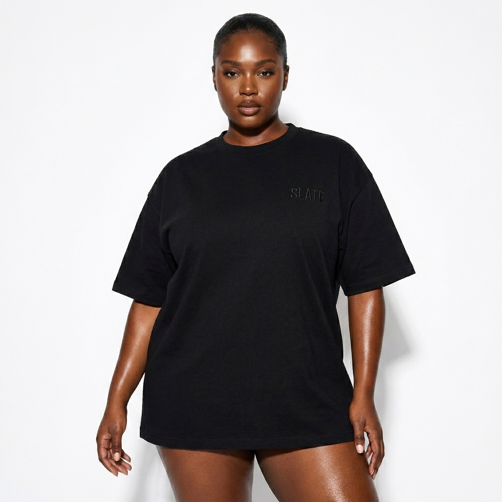 Unisex Oversized Cotton T-Shirt worn by a curvy Black female fashion influencer, minimalist luxury styling, studio lookbook — custom unisex oversized cotton t-shirt