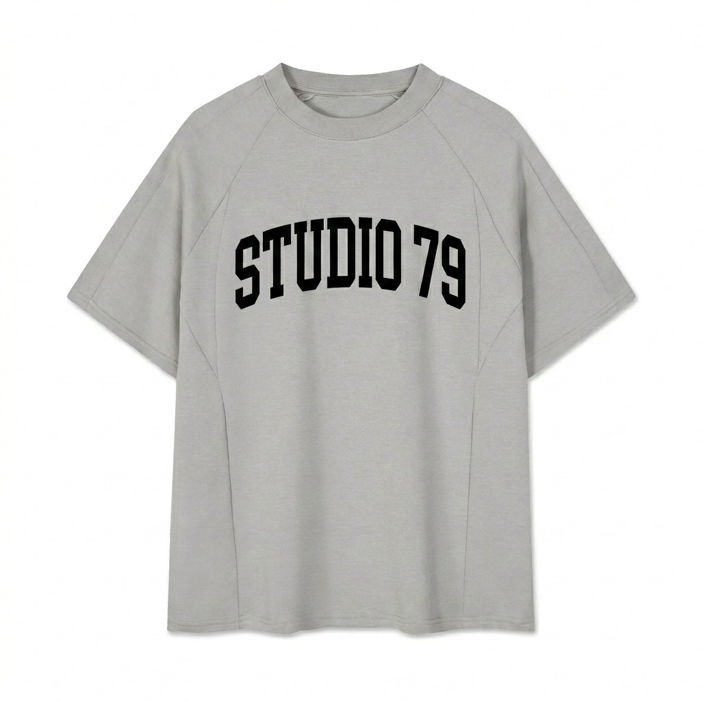 Custom Unisex Oversized Paneled Raglan T-Shirt design direction 3: Retro Collegiate Emblem featuring the STUDIO 79 wordmark
