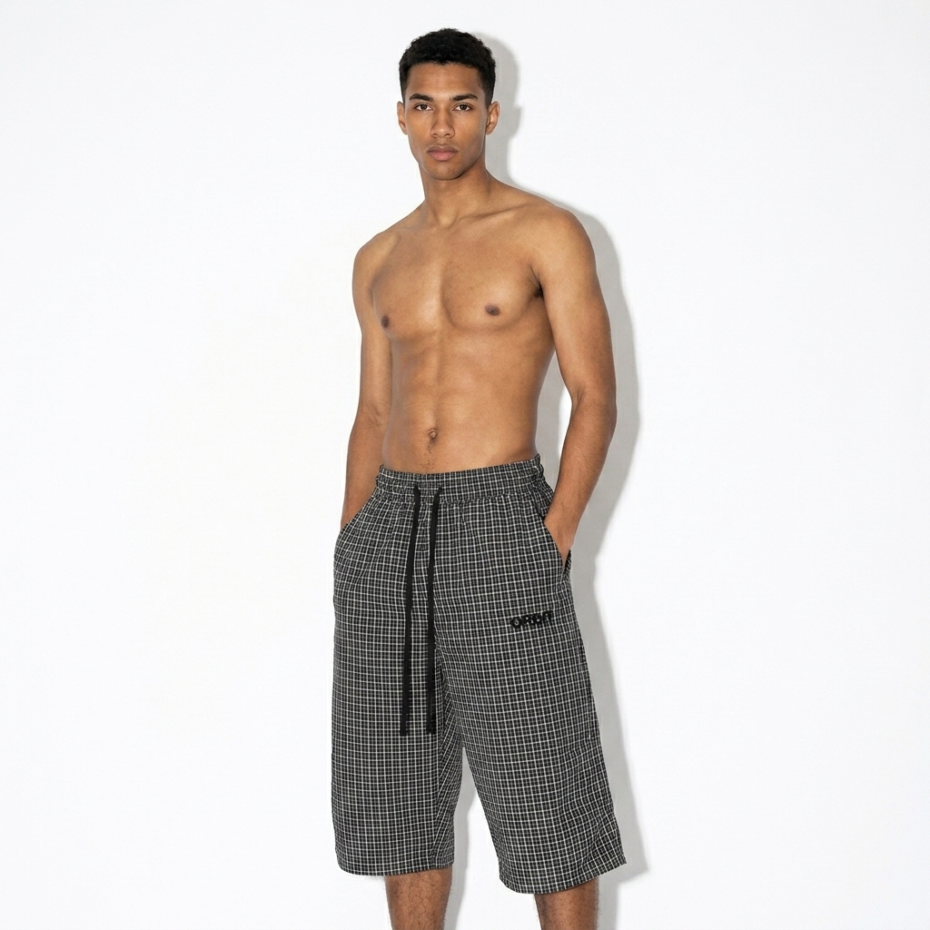 Unisex Plaid Loose Capri Shorts worn by a slim tall Mixed-race male fashion influencer, techwear modern styling, studio lookbook — custom unisex plaid loose capri shorts