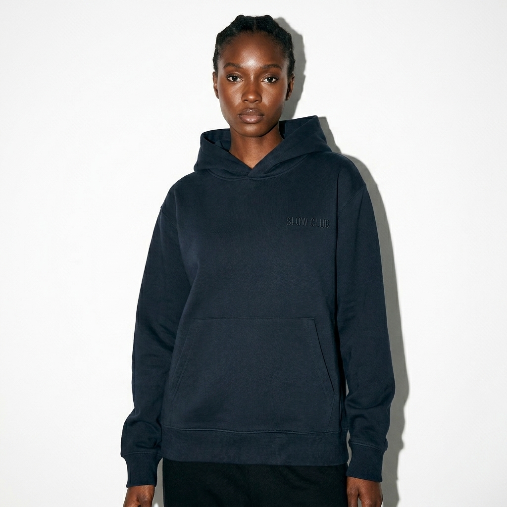 Unisex Pullover Hoodie worn by a lean West African female fashion influencer, downtown streetwear styling, studio lookbook — custom unisex pullover hoodie