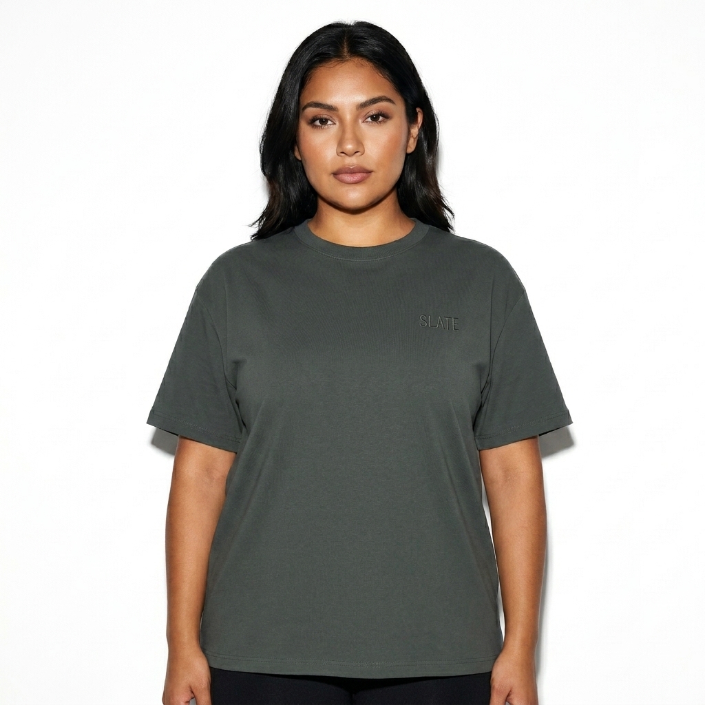 Unisex Quick-Dry Boxy T-Shirt worn by a mid-size Mexican female fashion influencer, techwear modern styling, studio lookbook — custom unisex quick-dry boxy t-shirt