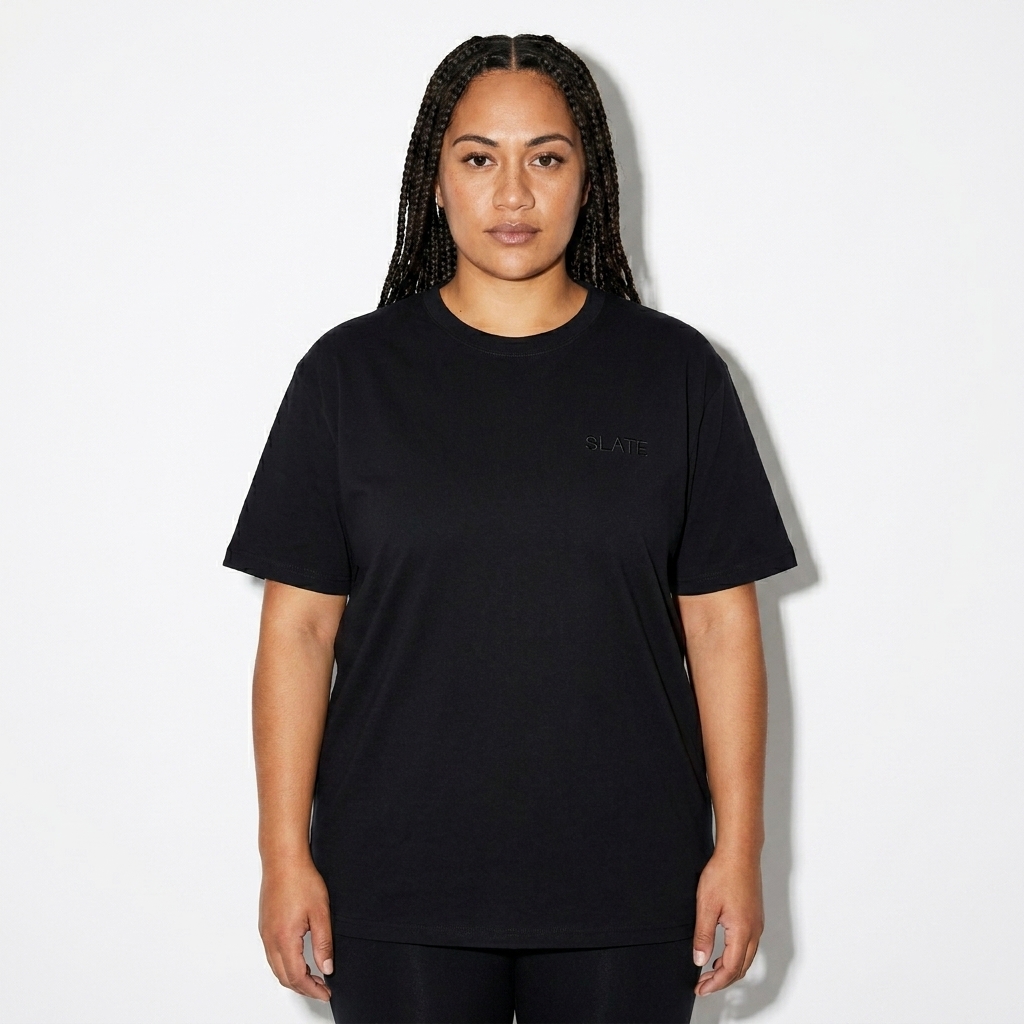 Unisex Seamless Cotton T-Shirt worn by a mid-size Māori female fashion influencer, editorial avant-garde styling, studio lookbook — custom unisex seamless cotton t-shirt