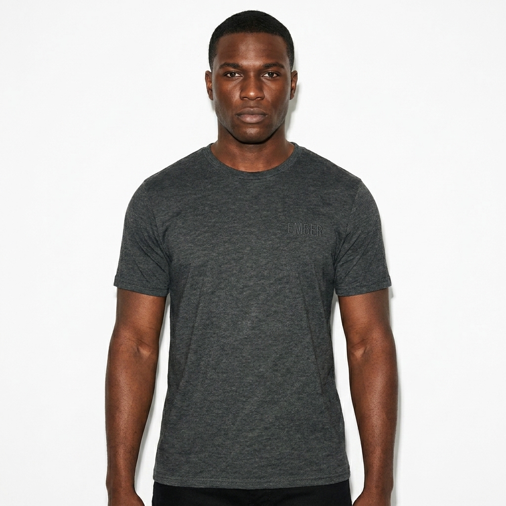 Unisex Softstyle T-Shirt worn by a broad-shouldered African American male fashion influencer, downtown streetwear styling, studio lookbook — custom unisex softstyle t-shirt