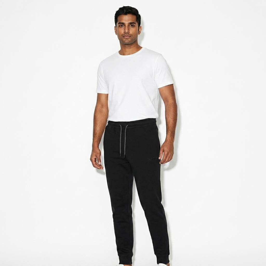 Unisex Tapered Joggers worn by a mid-size Indian male fashion influencer, downtown streetwear styling, studio lookbook — custom unisex tapered joggers