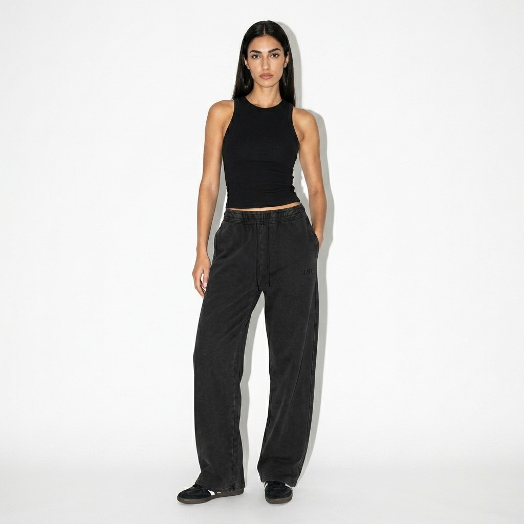Unisex Vintage Wash Sweatpants worn by a slim tall Mediterranean female fashion influencer, minimalist luxury styling, studio lookbook — custom unisex vintage wash sweatpants