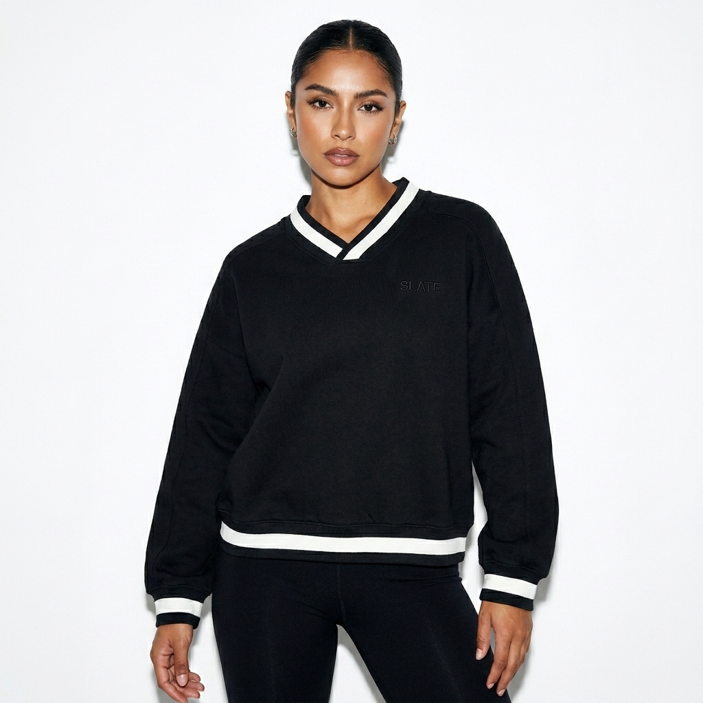 V-Neck Contrast Collar Boxy Sweatshirt worn by a toned Mexican female fashion influencer, workwear utility styling, studio lookbook — custom v-neck contrast collar boxy sweatshirt