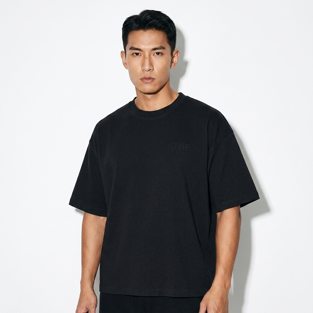Vintage Wash Boxy T-Shirt worn by a toned Chinese male fashion influencer, sporty athleisure styling, studio lookbook — custom vintage wash boxy t-shirt