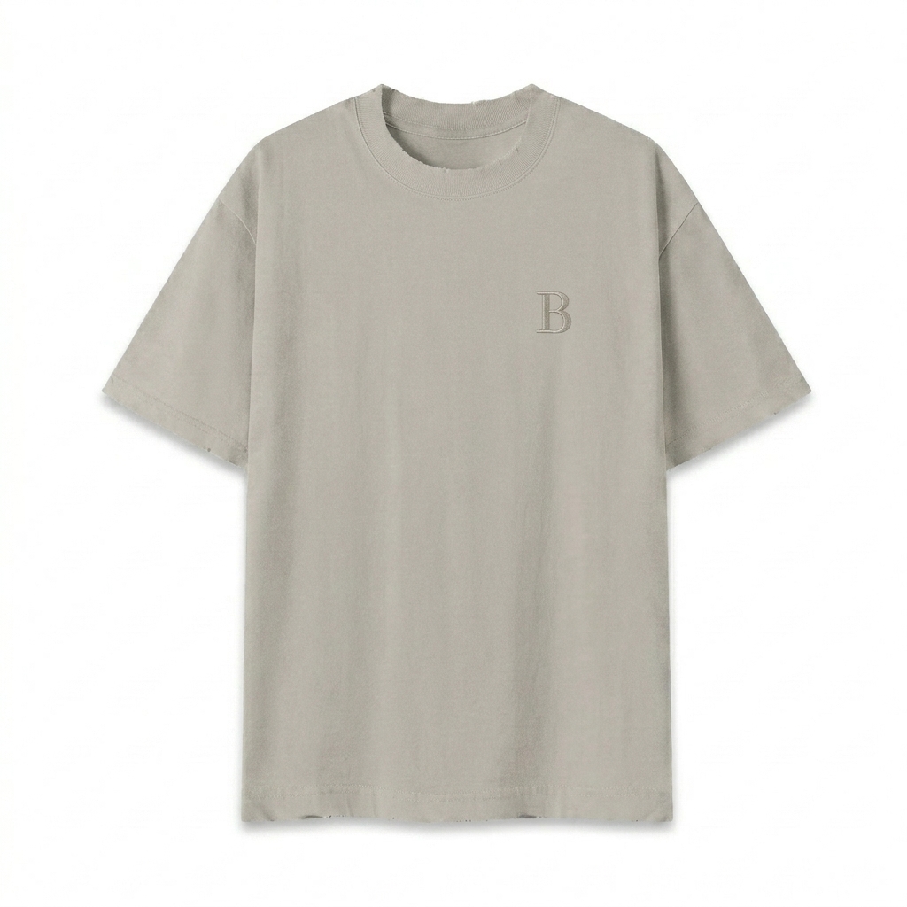 Custom Vintage Wash Distressed T-Shirt design direction 1: Subtle Monogram featuring the BASIN wordmark