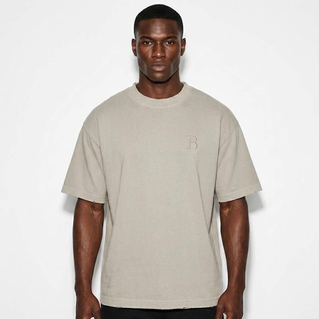 Vintage Wash Distressed T-Shirt worn by a athletic muscular West African male fashion influencer, sporty athleisure styling, studio lookbook — custom vintage wash distressed t-shirt