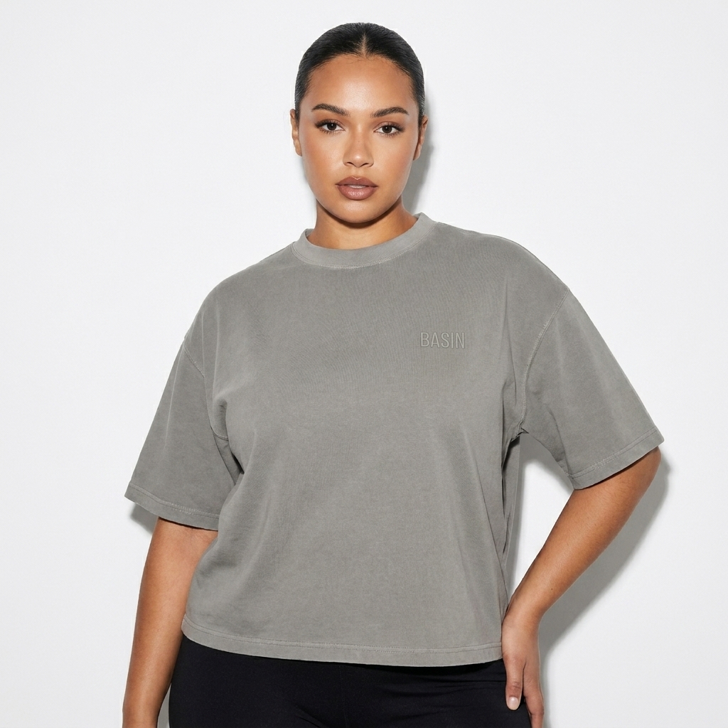Vintage Washed Boxy T-Shirt worn by a curvy British female fashion influencer, preppy ivy styling, studio lookbook — custom vintage washed boxy t-shirt