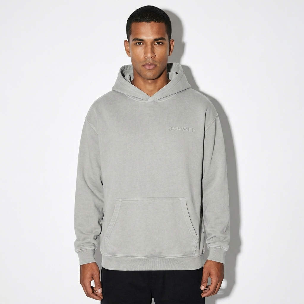 Vintage Washed Cotton Hoodie worn by a toned Brazilian male fashion influencer, downtown streetwear styling, studio lookbook — custom vintage washed cotton hoodie