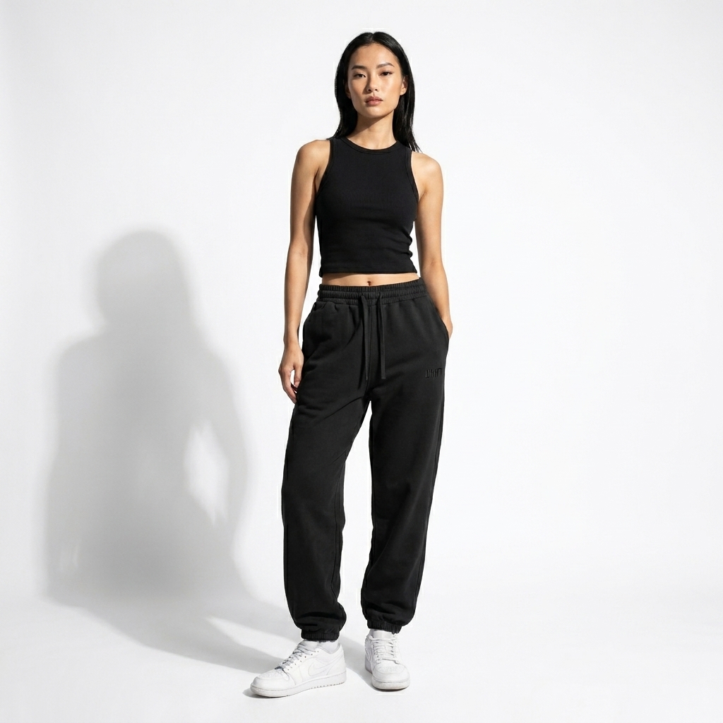 Vintage Washed Cotton Sweatpants worn by a lean Vietnamese female fashion influencer, y2k revival styling, studio lookbook — custom vintage washed cotton sweatpants
