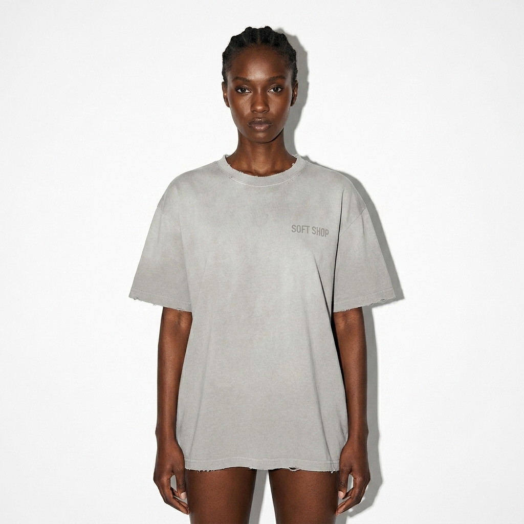 Vintage Washed Frayed T-Shirt worn by a slim tall Afro-Caribbean female fashion influencer, techwear modern styling, studio lookbook — custom vintage washed frayed t-shirt