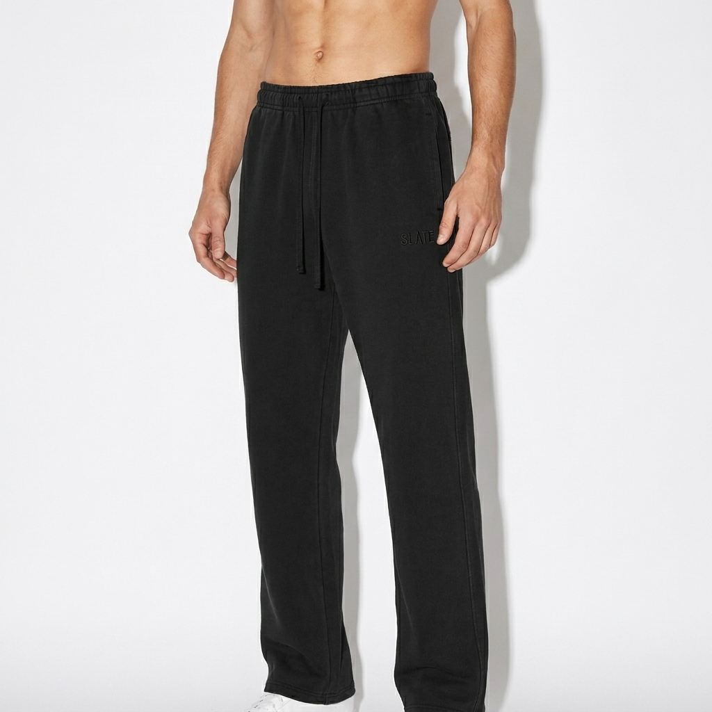 Vintage Washed Sweatpants worn by a slim tall German male fashion influencer, y2k revival styling, studio lookbook — custom vintage washed sweatpants