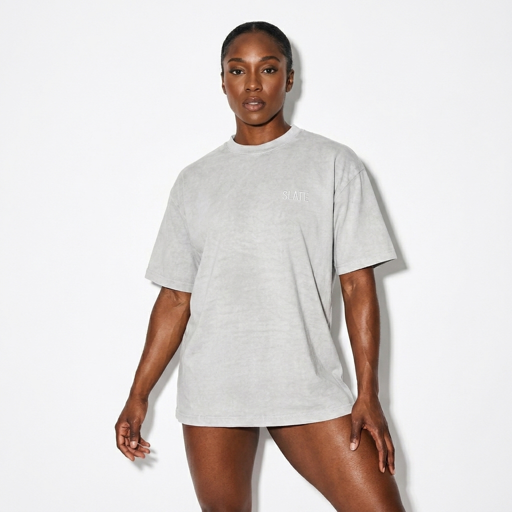 Washed Loose T-Shirt worn by a athletic muscular Afro-Caribbean female fashion influencer, y2k revival styling, studio lookbook — custom washed loose t-shirt