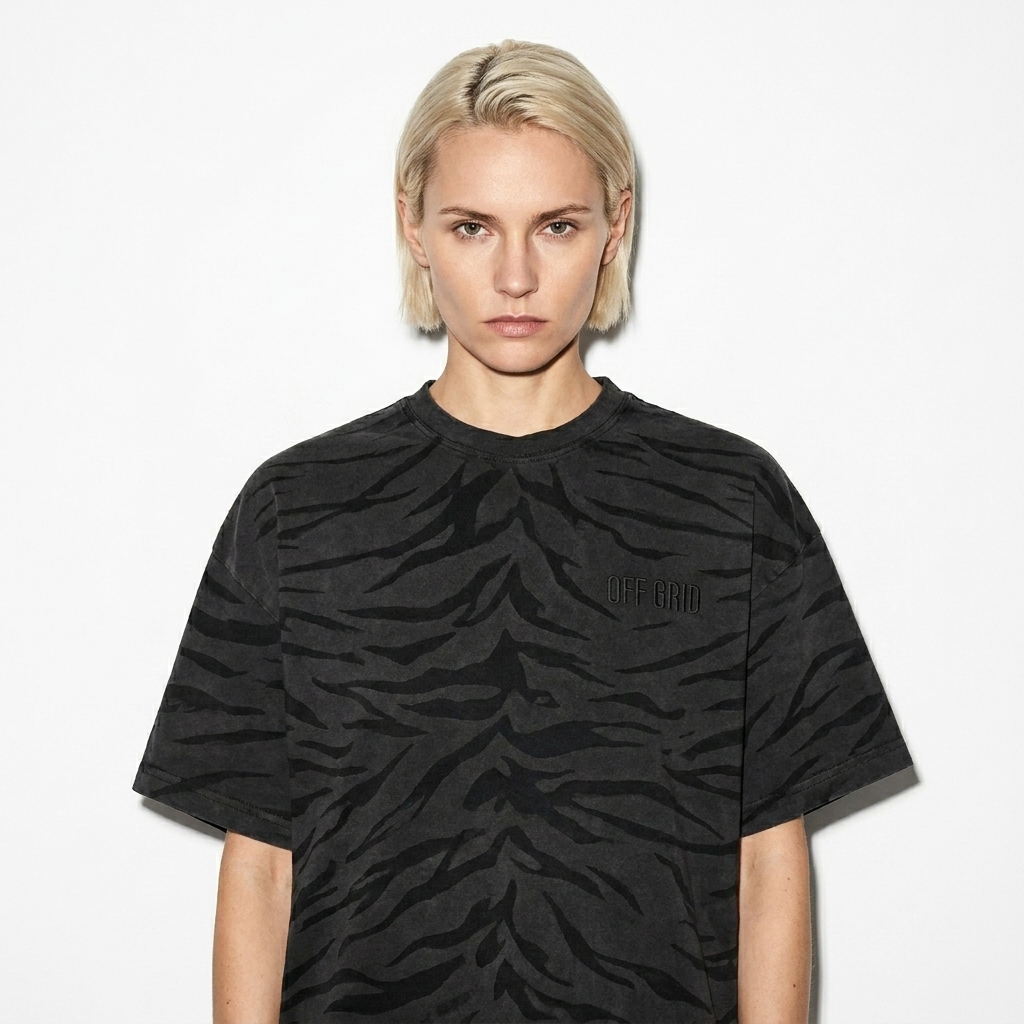 Washed Tiger Stripe T-Shirt worn by a lean German female fashion influencer, gorpcore outdoor styling, studio lookbook — custom washed tiger stripe t-shirt
