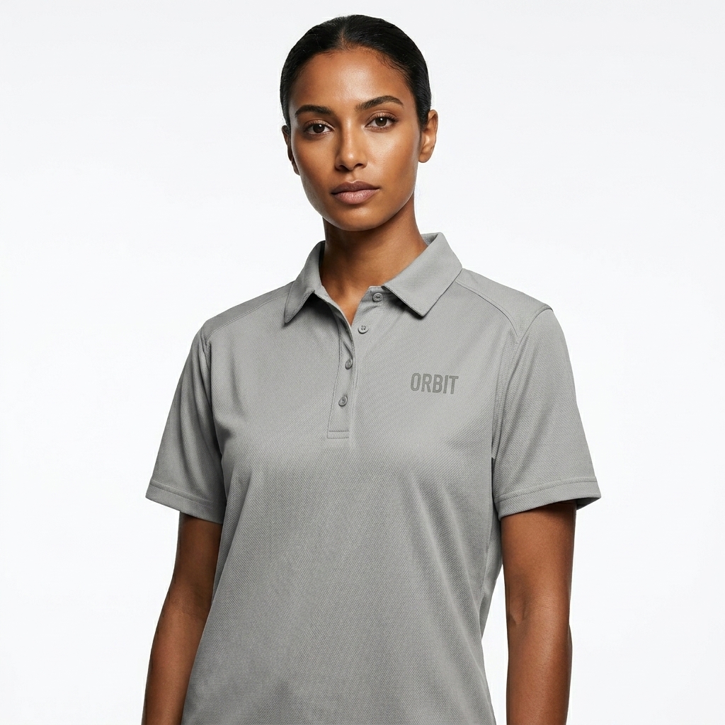 Women's Performance Polo worn by a toned North African female fashion influencer, editorial avant-garde styling, studio lookbook — custom women's performance polo
