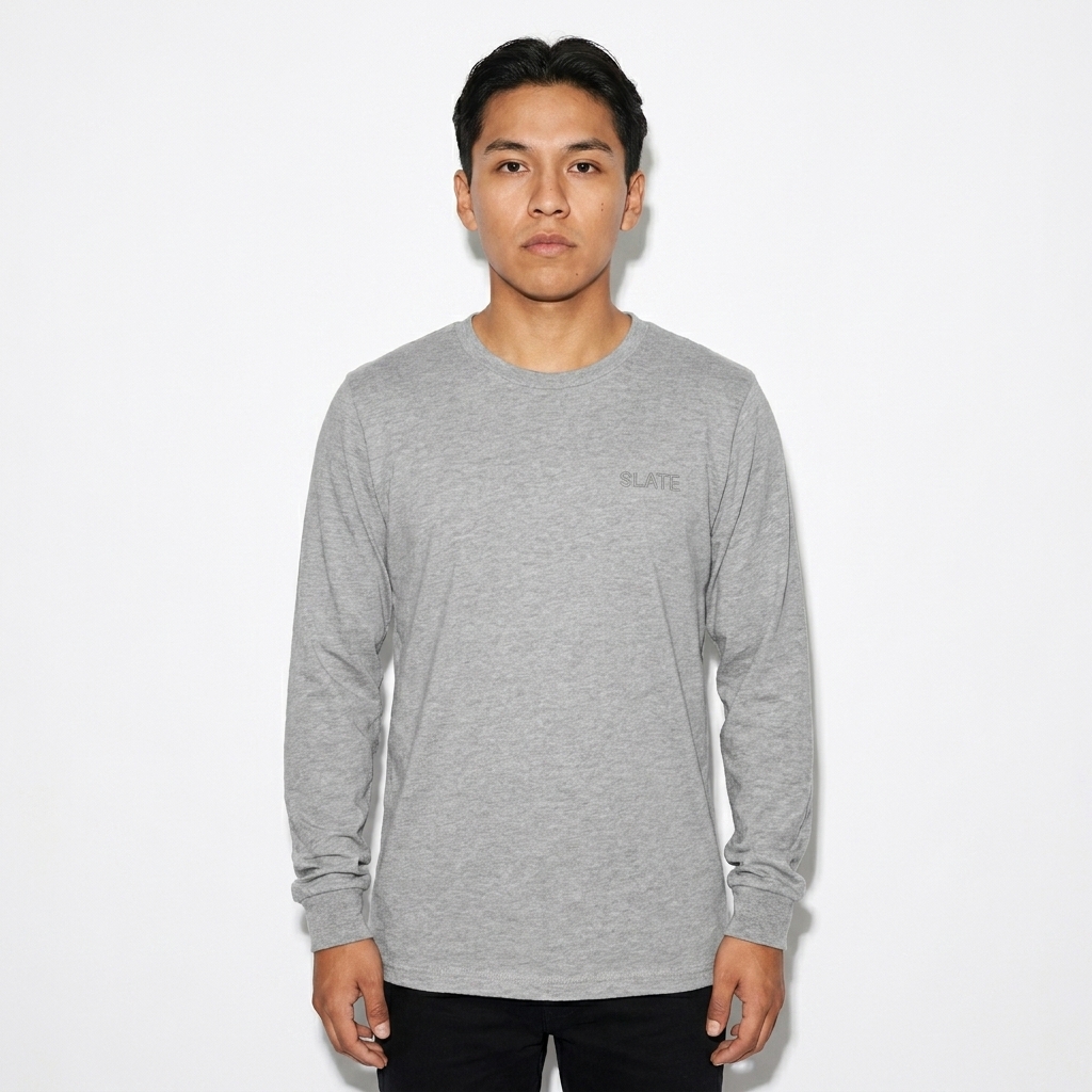 Youth Long Sleeve T-Shirt worn by a petite Indigenous American male fashion influencer, downtown streetwear styling, studio lookbook — custom youth long sleeve t-shirt